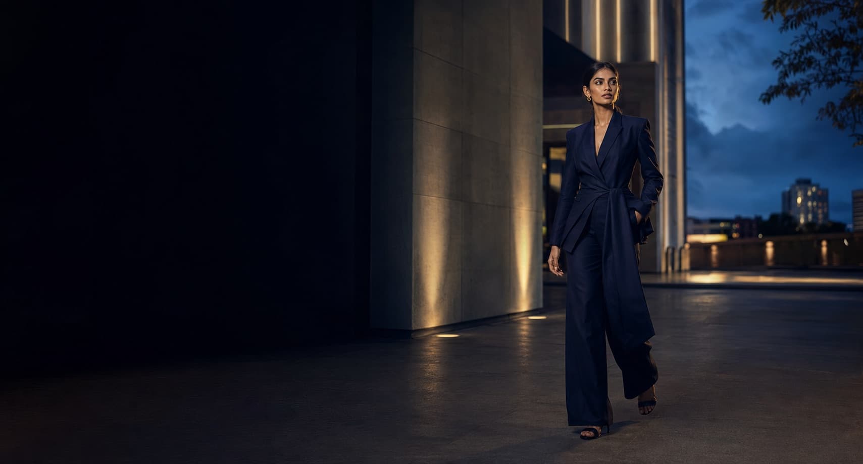 South Asian model in midnight tailoring at blue hour